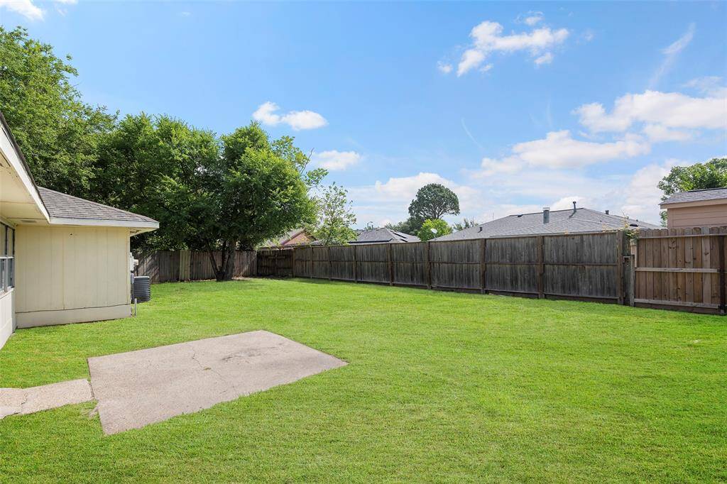 Step outside and view the backyard space!  There is a concrete patio area perfect for sitting outside with a cool beverage or maybe a table and chairs for dining al fresco!
