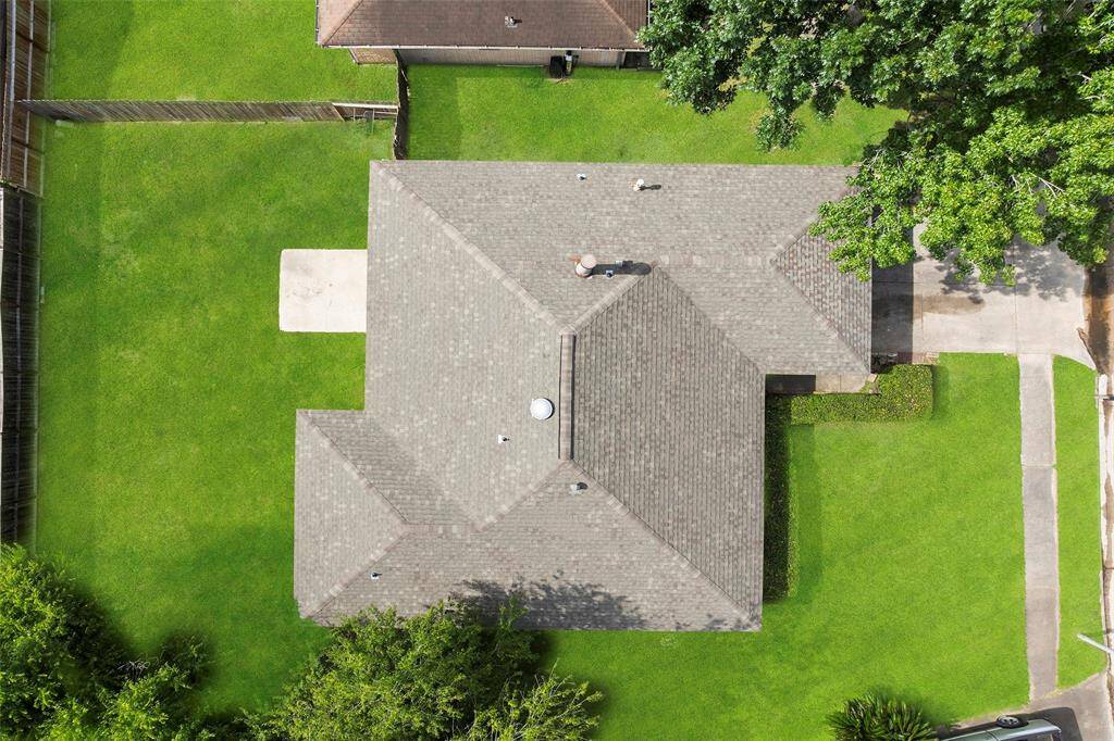 This aerial view shows the elbow room with this wonderful home, plus the recent roof ready to weather the storm. Schedule your showing today!