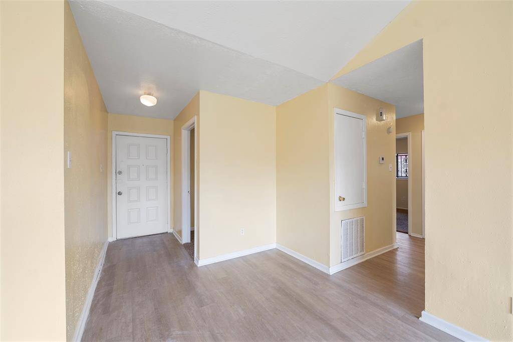 Open the door to a move-in ready home with fresh paint and pretty flooring that flows throughout the main living areas!
