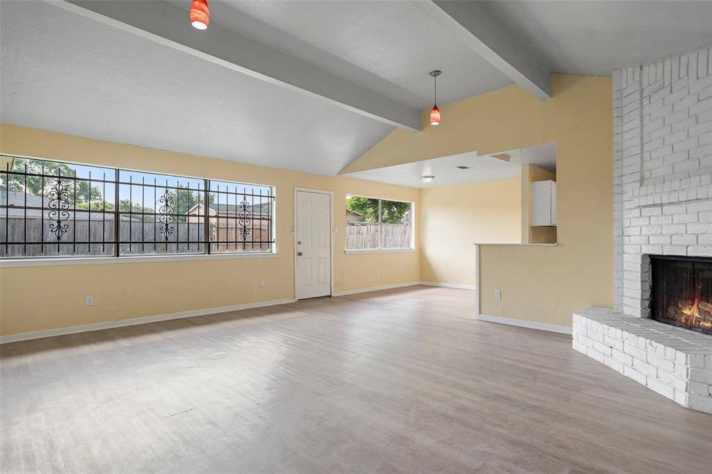 A semi open floor plan features a large family room with picture windows, and direct access to the dining area!