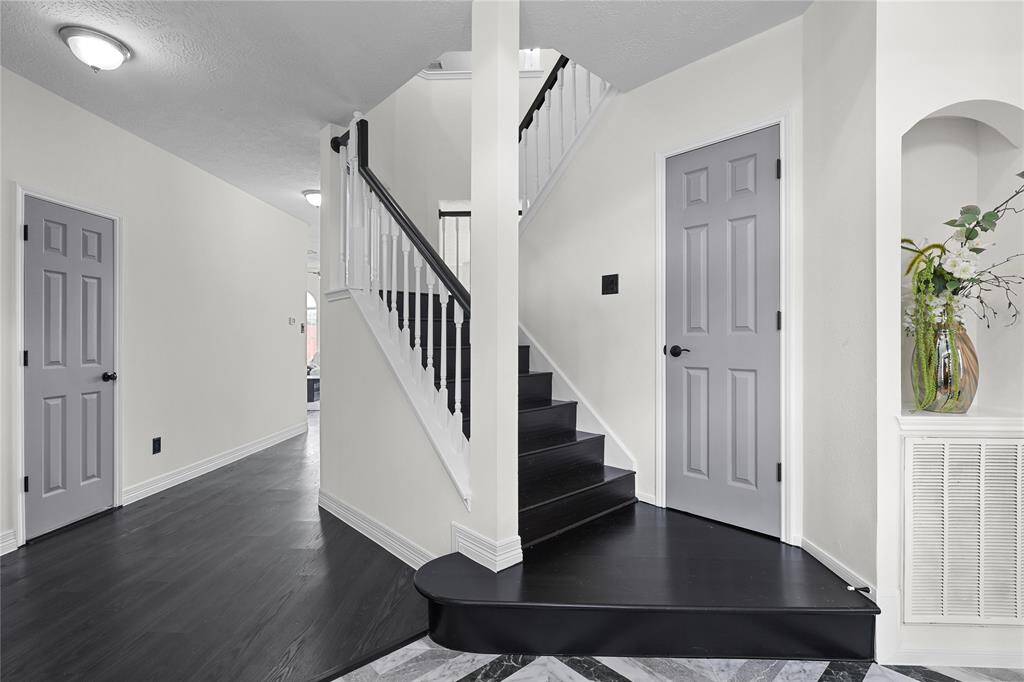 Upstairs leads up to 4-bedrooms and gameroom