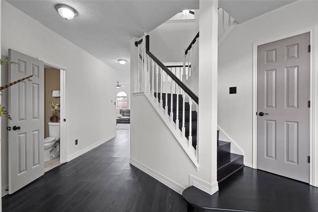 Foyer:  Dining Room to the right, Primary Ensuite to the left, half bathroom as you going down the hallway the family room and kitchen over look the saltwater pool.  Located upstairs  are 4-bedroom & gameroom