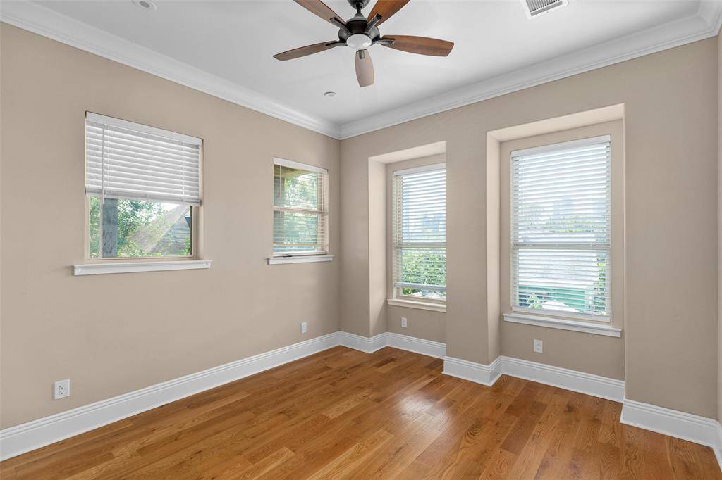 This is the third spacious secondary bedroom with hardwood flooring, is located in the second floor. It features a walk-in closet and an en-suite bathroom.