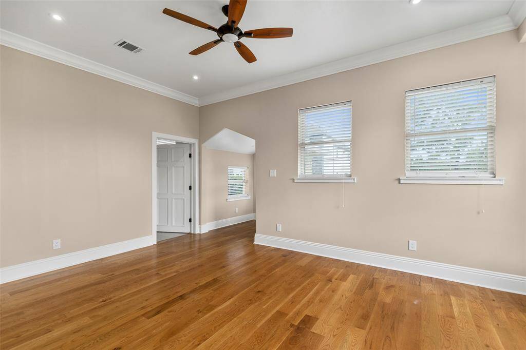 This spacious fourth secondary bedroom with hardwood flooring, is located in the second floor. It features a walk-in closet and an en-suite bathroom.  Also, this room features a bay window facing the street, perfect for a desk or reading area.