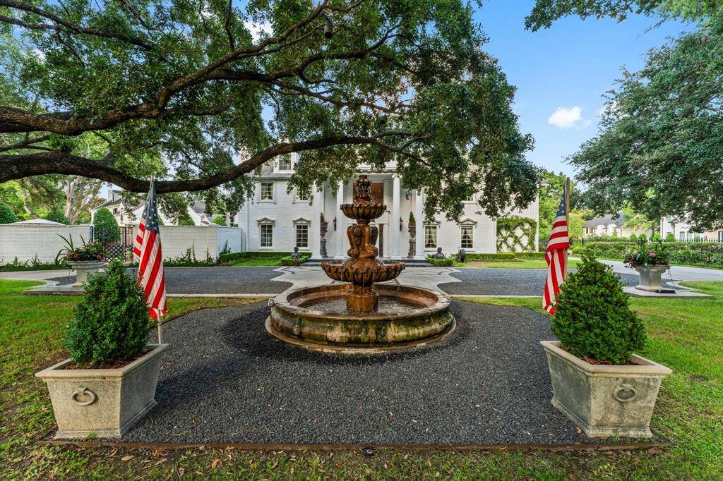 The vintage fountain and lush landscaping greet you at the entrance