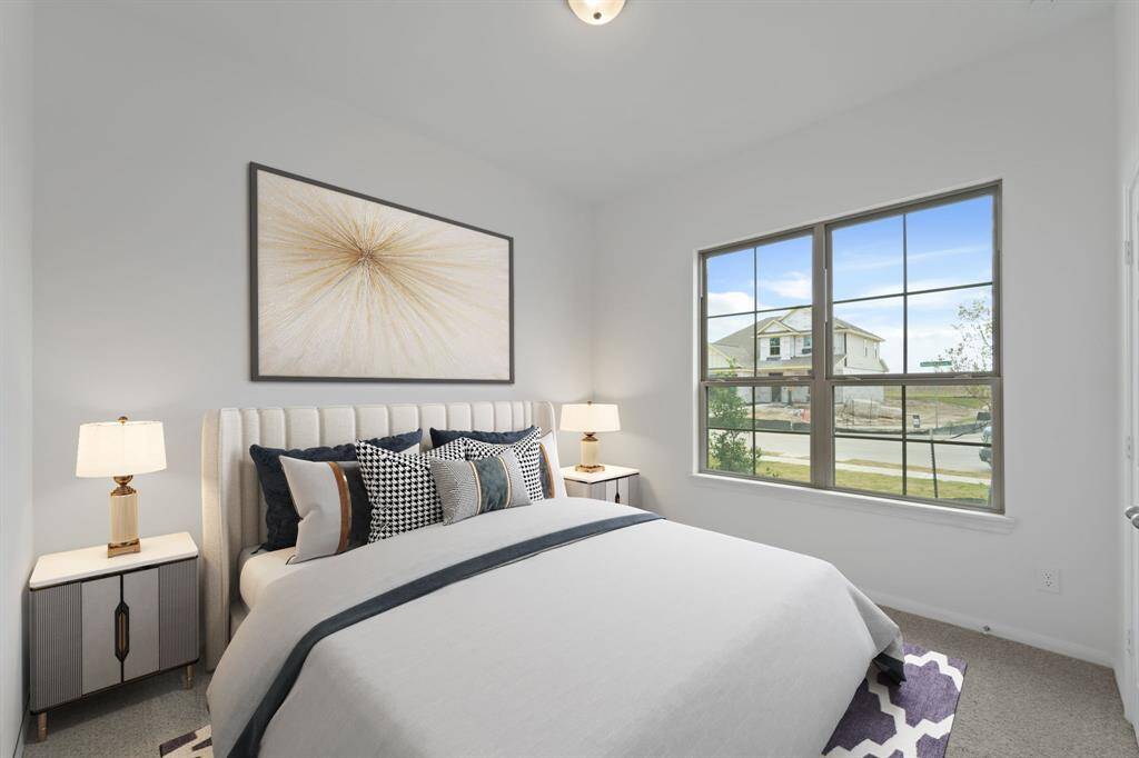 Your secondary bedroom features plush carpet, fresh paint, closet, and a large window that lets in plenty of natural lighting.