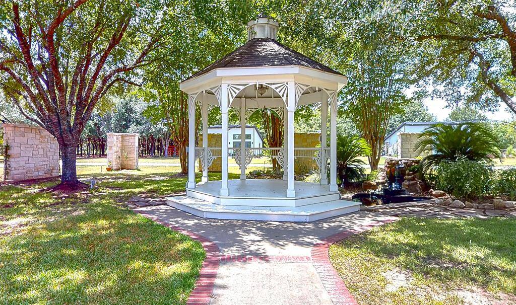 Multiple photo opportunity settings throughout the grounds. Pictured Gazebo & Waterfall Pond in the Garden