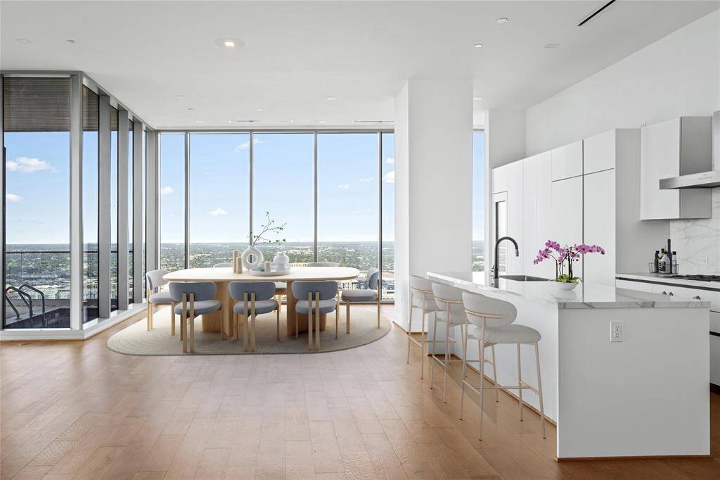 Residences at the Allen Penthouse features 12 ft ceilings, Gaggenaua appliances, Pedini Italian cabinets, porcelain counter tops and back splashes. This particular residences offers additional cabinetry, wine refigerator plus space for possible wine room, pantry and or a second kitchen. Virtually Staged