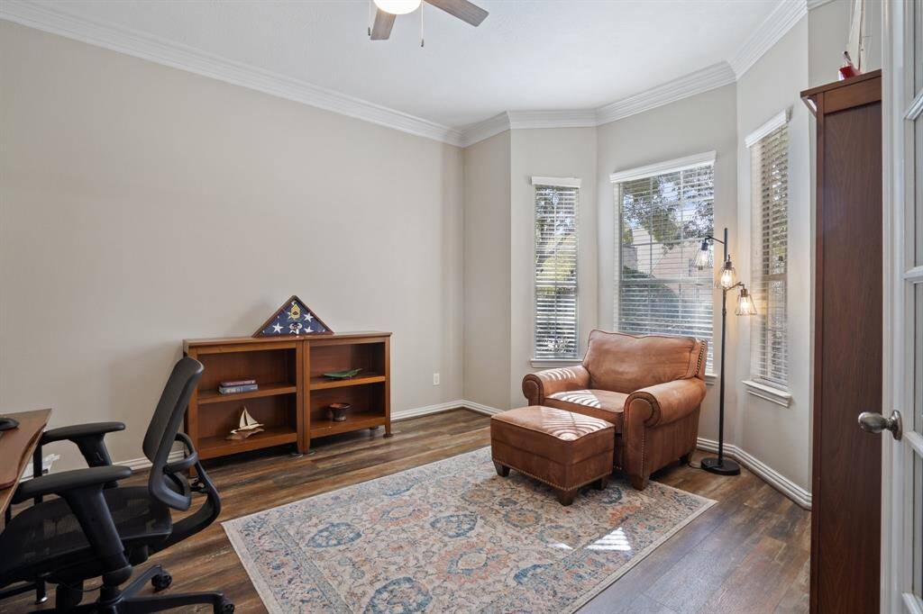 To the right of the entry hallway is the Formal Living room which also has the added touch of crown molding and bay window for seating area.