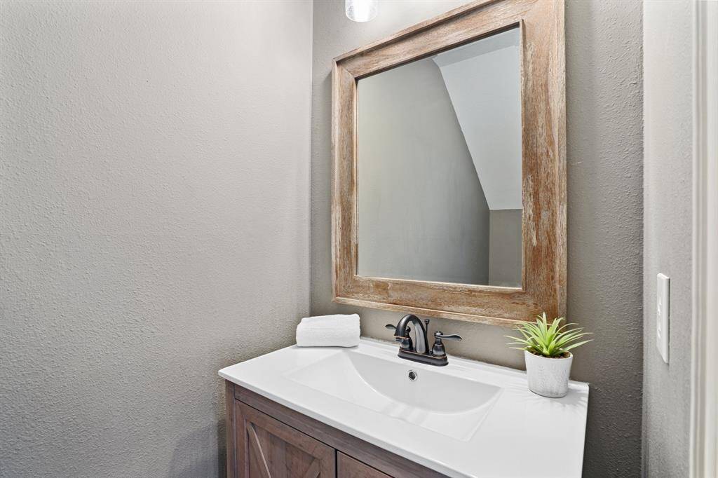 Powder room just after the stairs.