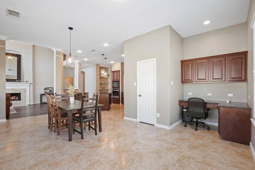 This unique space is large enough for your more casual meals and even has a small workspace off to the side.