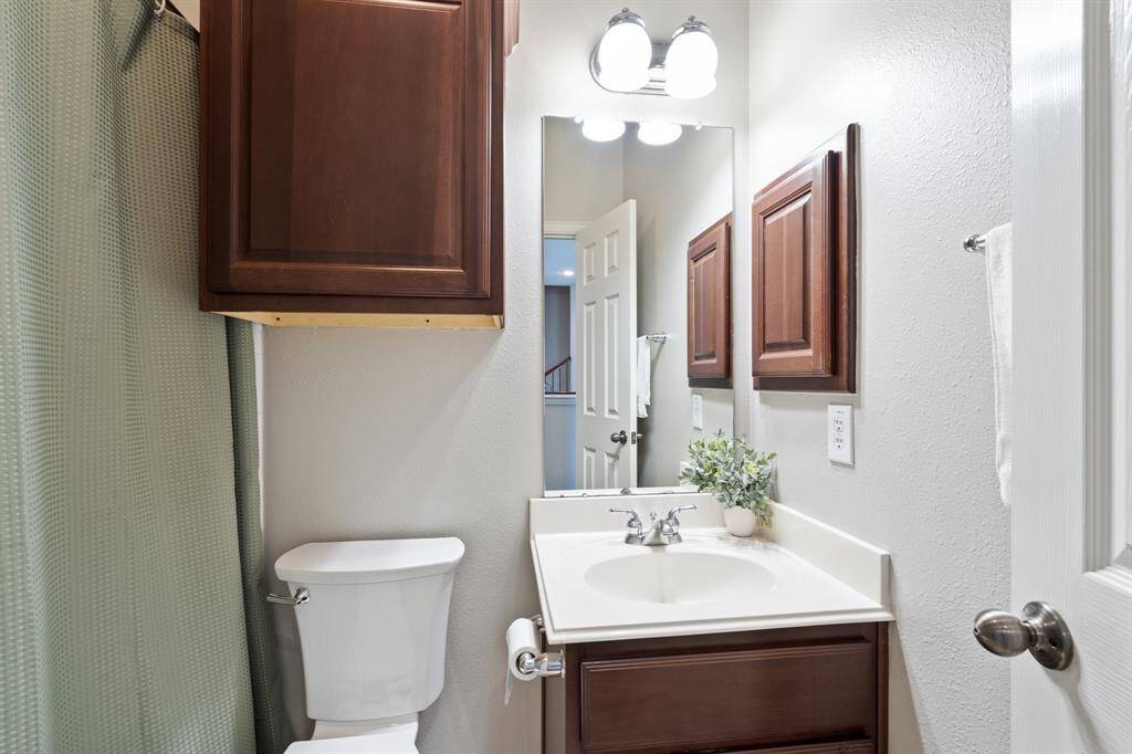 2nd floor full bathroom off the landing area near a secondary bedroom.