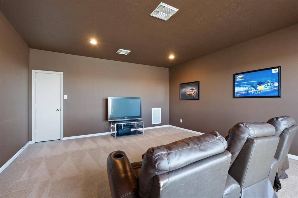 3rd floor media room with access to attic.