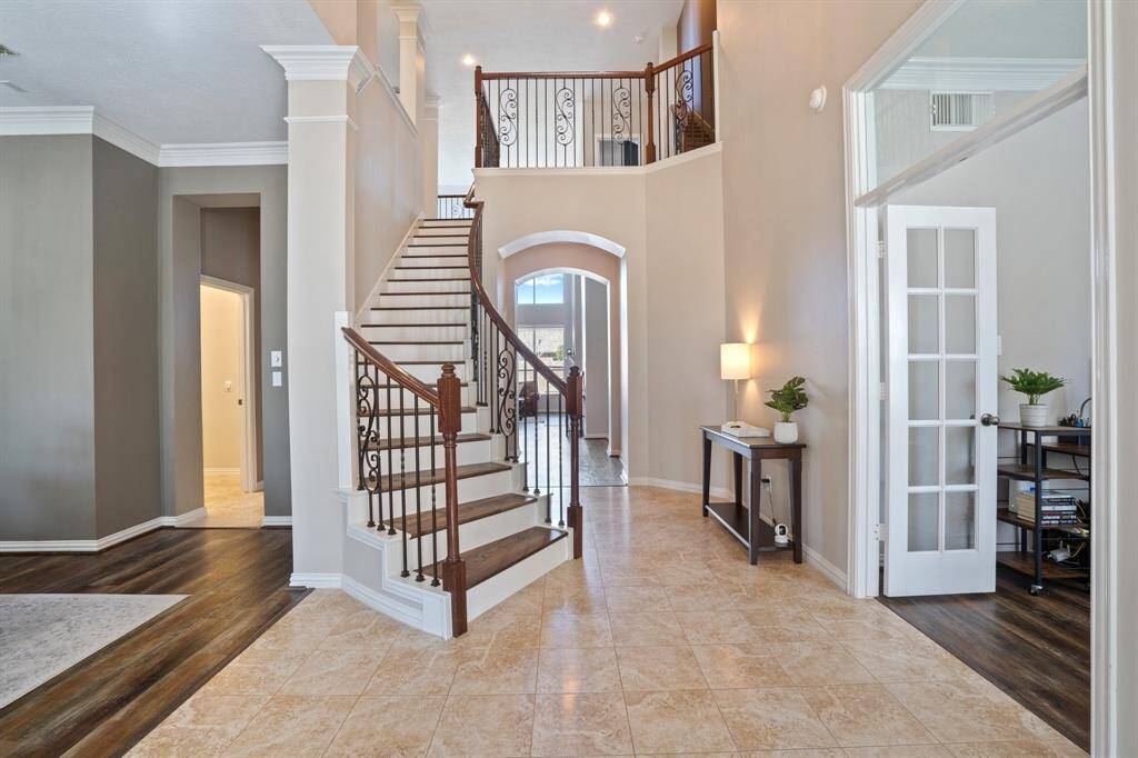 Very inviting foyer with the beautiful staircase leading to the second floor. The formal dining is on the left, and formal living on the right.