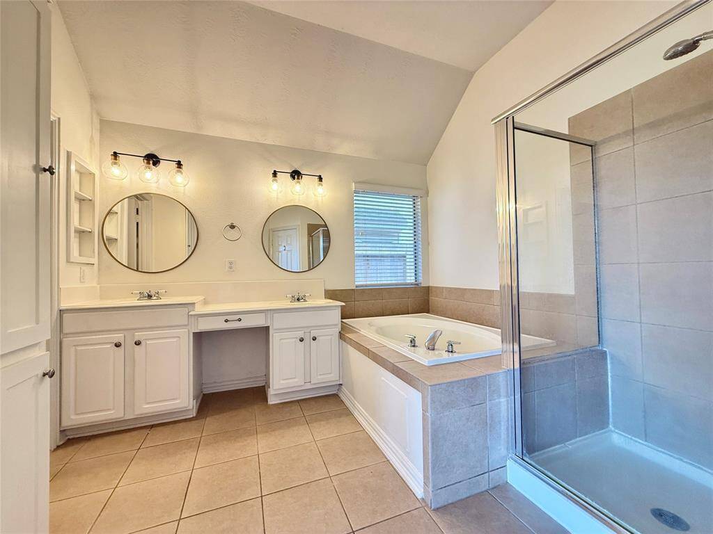 Enjoy the en-suite’s soaking tub, walk-in shower, dual sinks, plus a private toilet corner