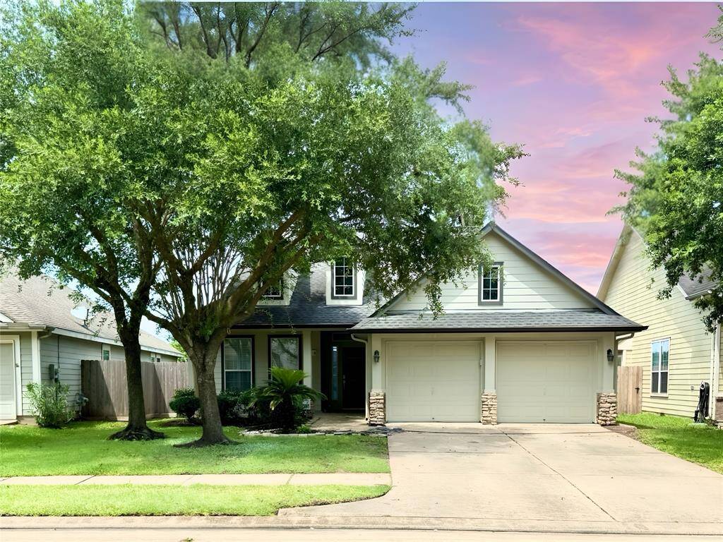 Spacious driveway with recently maintained exterior.