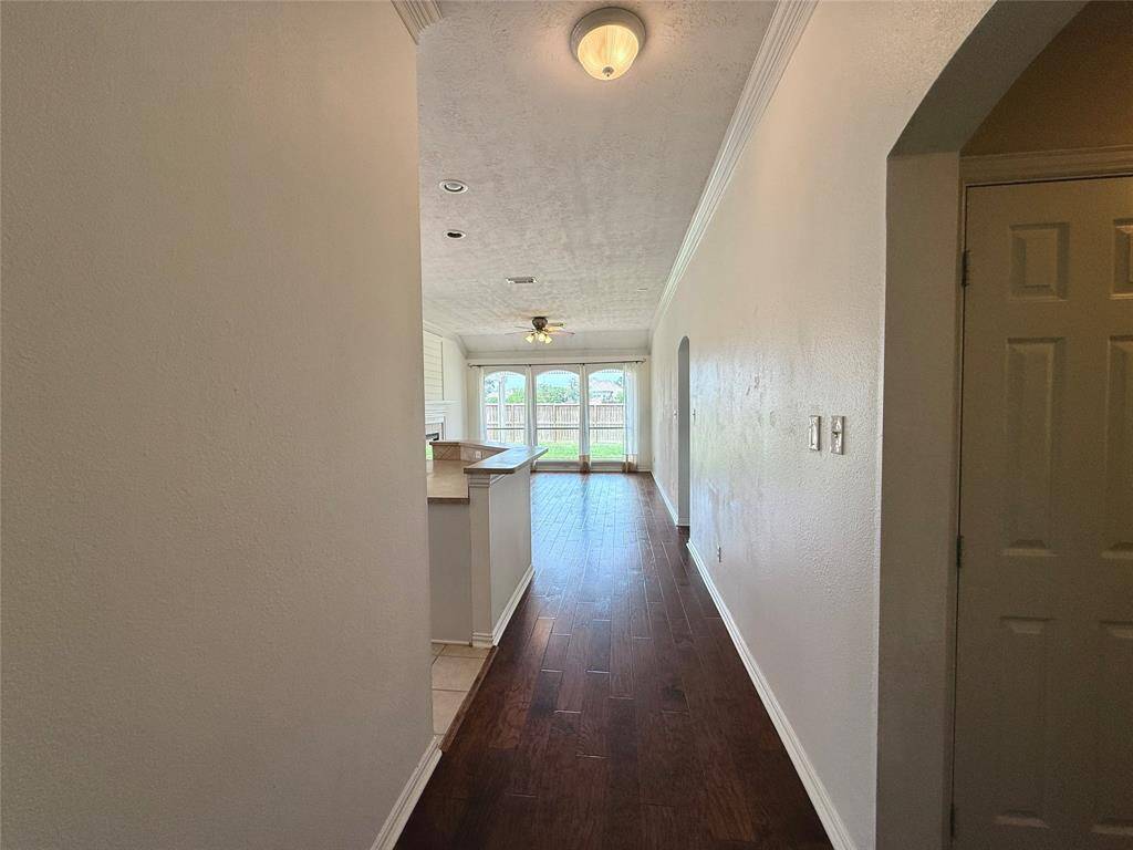 Enjoy engineered wood flooring throughout the shared living space.