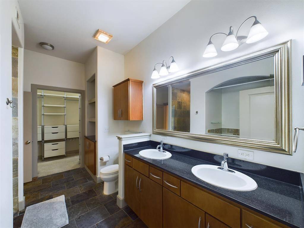 Bath with Dual Vanities, Granite Counters & Slate Tile