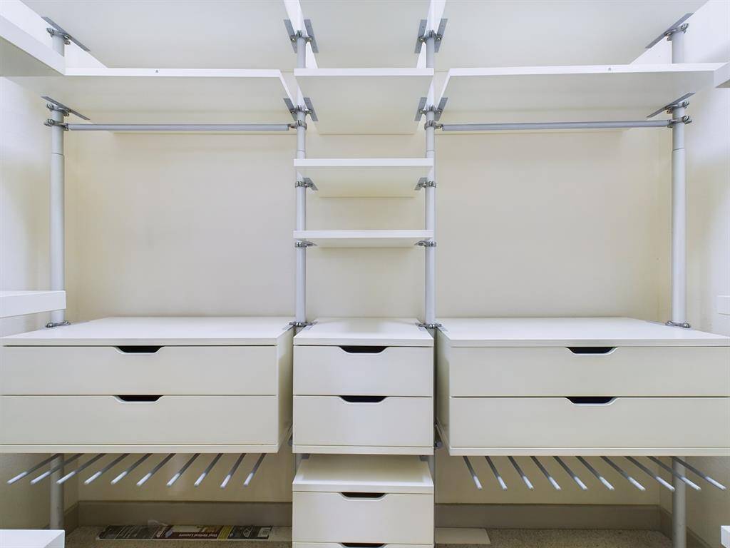 Custom Walk-in Closet with Drawers and Shelving