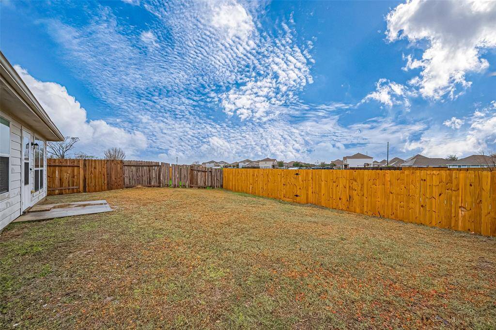 he backyard is a nice size, offering a blank canvas to create your vision. With plenty of possibilities, it's a perfect space for outdoor activities, gardening, or entertaining. A gate along the back of the property leads to the Cypress Place Park, providing easy access to outdoor recreation.