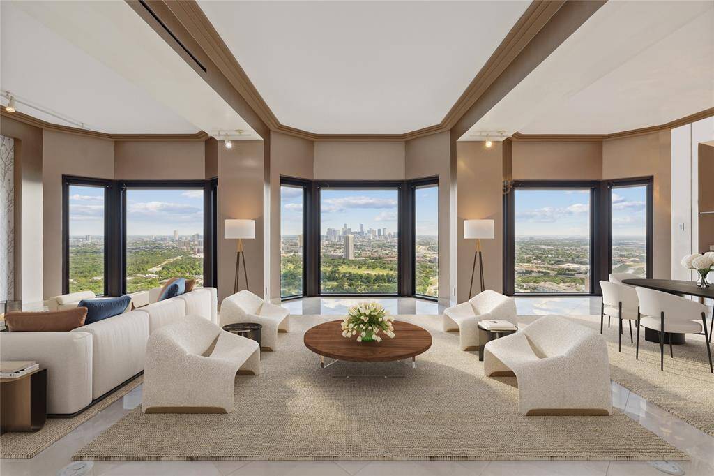 Wonderful open floor plan with 10 ft. ceilings and beautiful marble floors. 40th floor views of Hermann Park and the Downtown skyline. Image shown virtually staged.