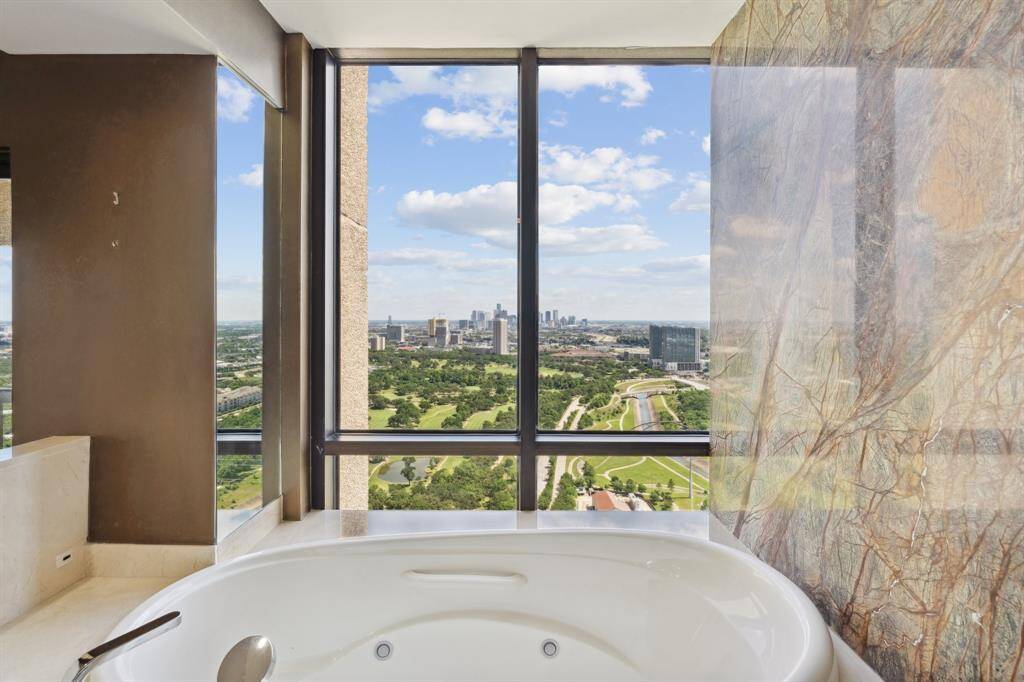 Spectacular views from the bathtub with slab stone surround.
