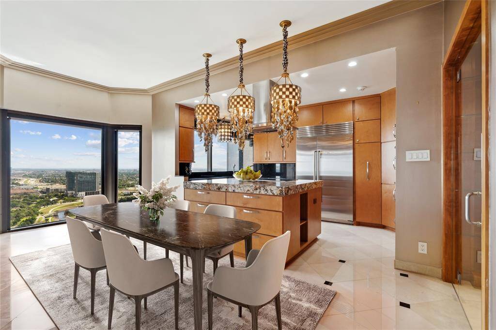 Large island kitchen with breakfast room. Image shown virtually staged.