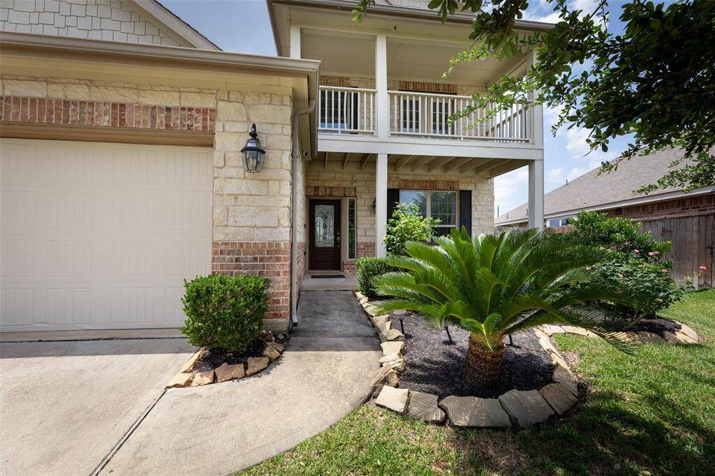 Spacious backyard with plenty of room for a pool features well-maintained lawn, covered patio area, extended pavers that are perfect for outdoor activities and gatherings.