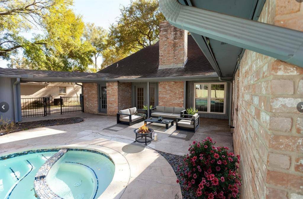 Covered patio accessible from the master bedroom and living areas. Features a quick connect gas line for easy grill or fire pit setup, perfect for cozy evenings.