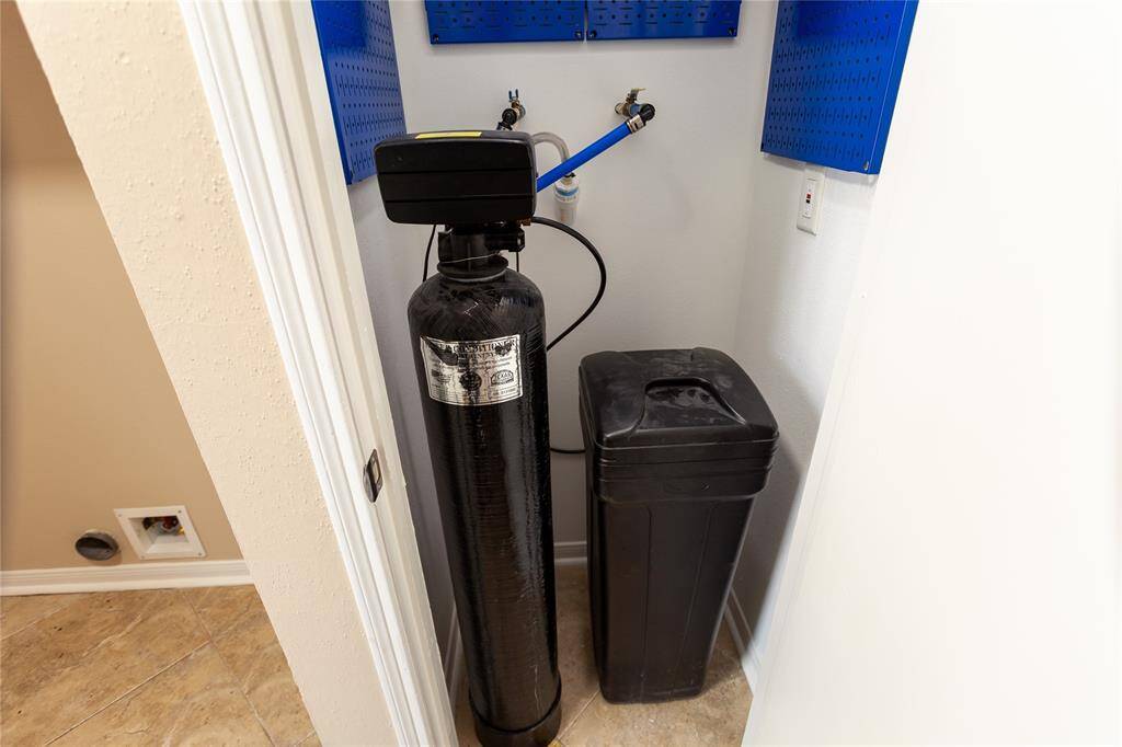 Water softener system for entire home tucked away in the laundry room.