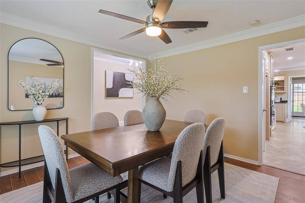 The room opens to a bright kitchen and living area, great for family gatherings