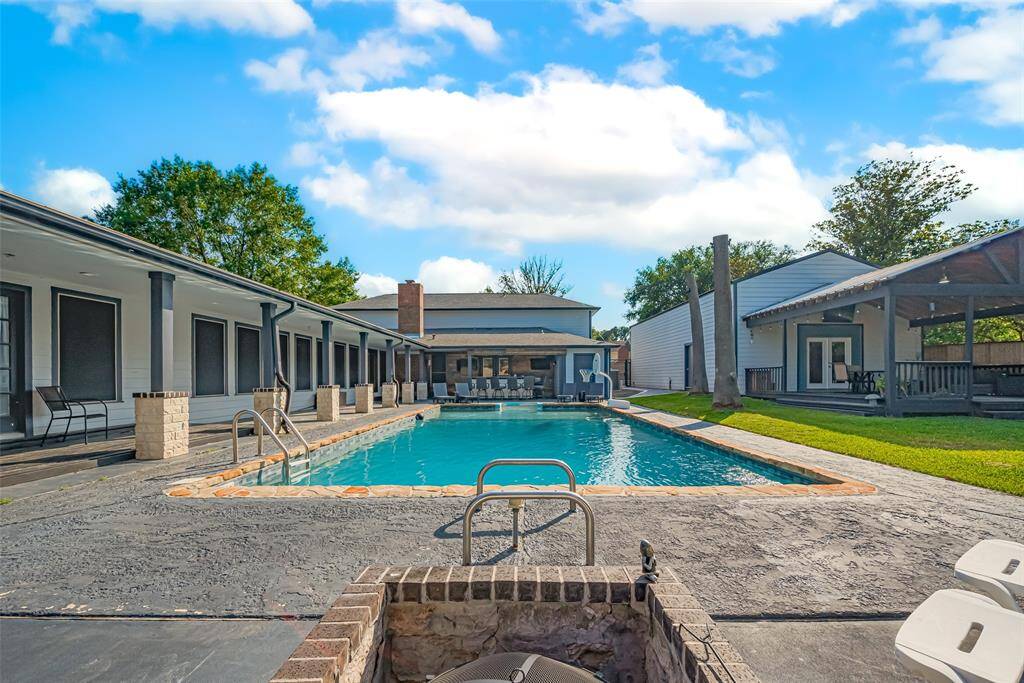The wrap-around porch offers a pool view from any angle.