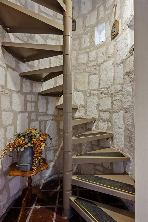 Spiral staircase takes you to each level in the guest house.