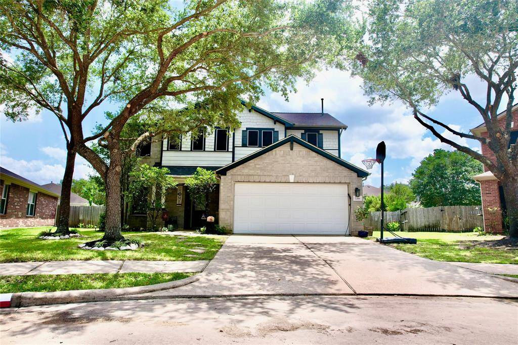 This inviting two-story home features a double garage and a spacious driveway