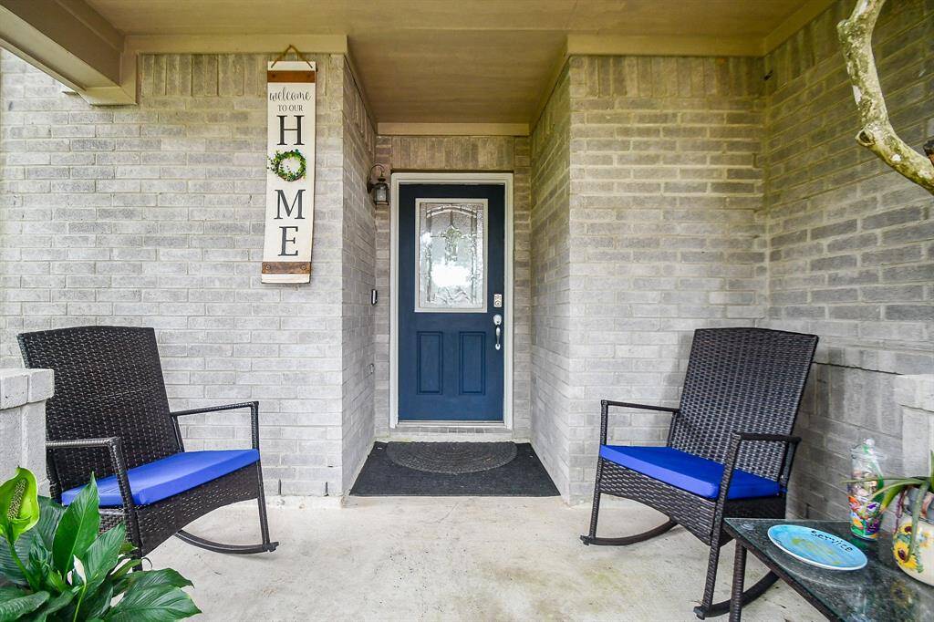 Charming front porch with a welcoming atmosphere, perfect for relaxing outdoors.