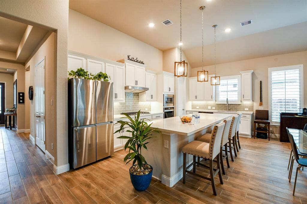High ceilings and recessed lighting through out!