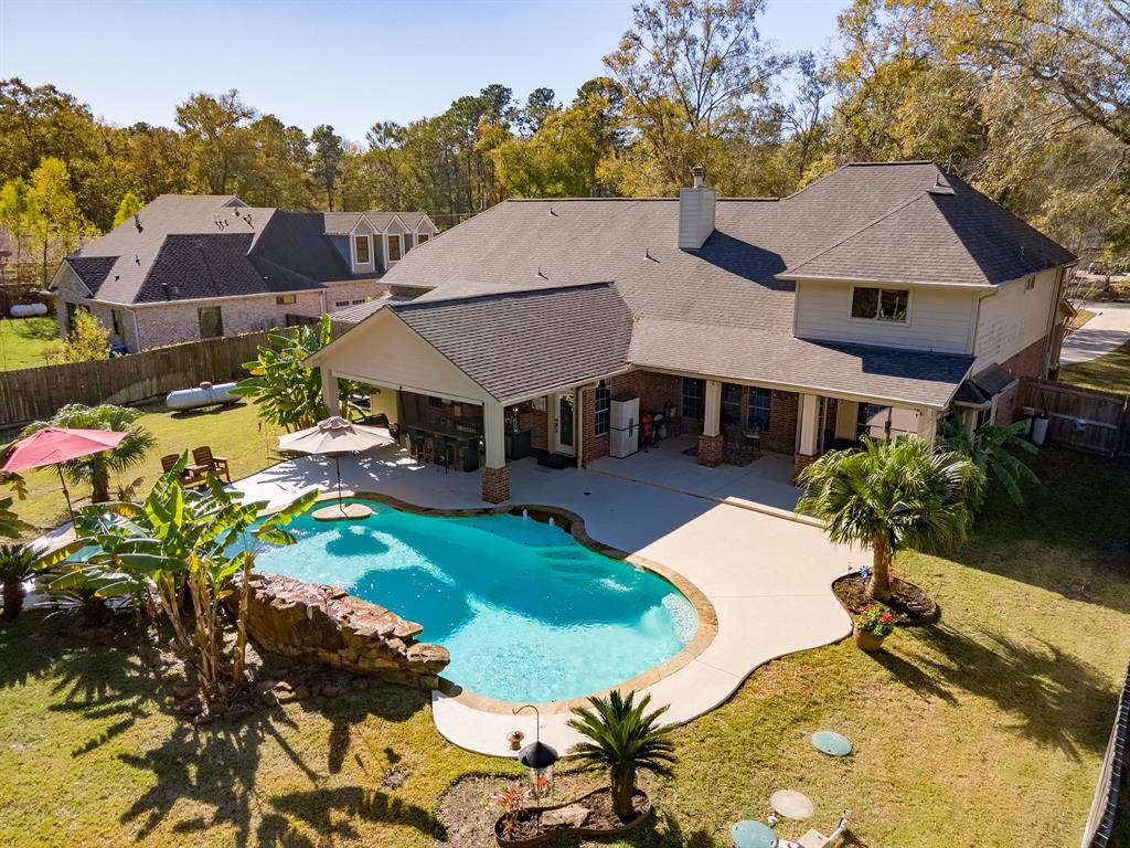 Situated on an 1-Acre Lot with a Beautiful Pool!