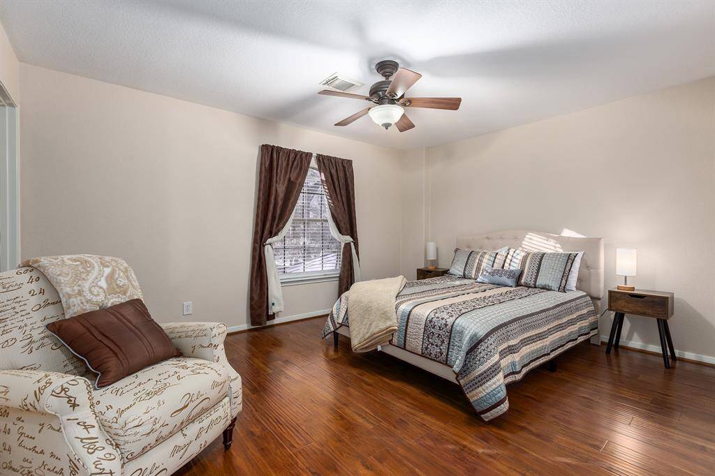 Upstairs Corner Bedroom With Engineered Wood Flooring and Large Walk-in Closet