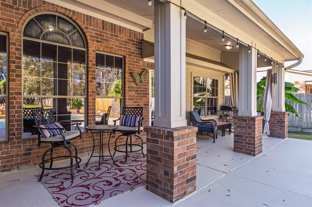 Additional Covered Backyard Seating Overlooking The Pool