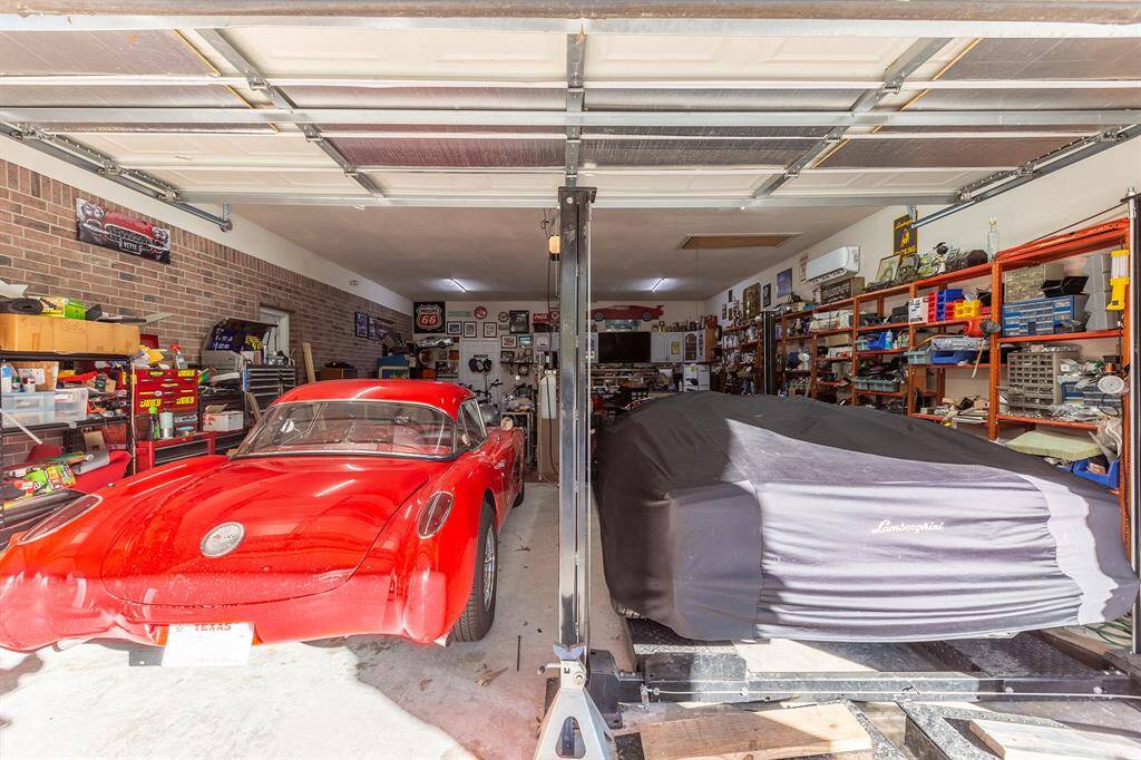 4-Car Tandem Garage  (975 Sq Ft) With Cabinets, Workbench, and Its Own Minisplit HVAC.