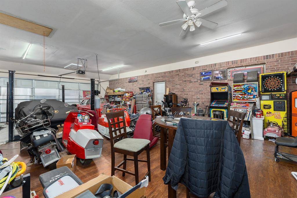 4-Car Garage/Workshop/Man Cave Equipped With Mini-split A/C and Heater, Half Bath, and Easy Access Rear Door to Backyard