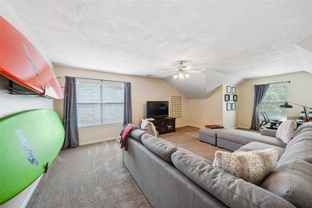 Large upstairs game room.  Also has walk in attic with decking