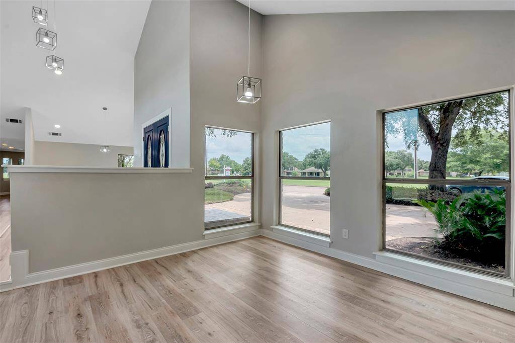 This "sitting room" could be a library area, home office space - or whatever you would like it to be. Large windows and more great views!