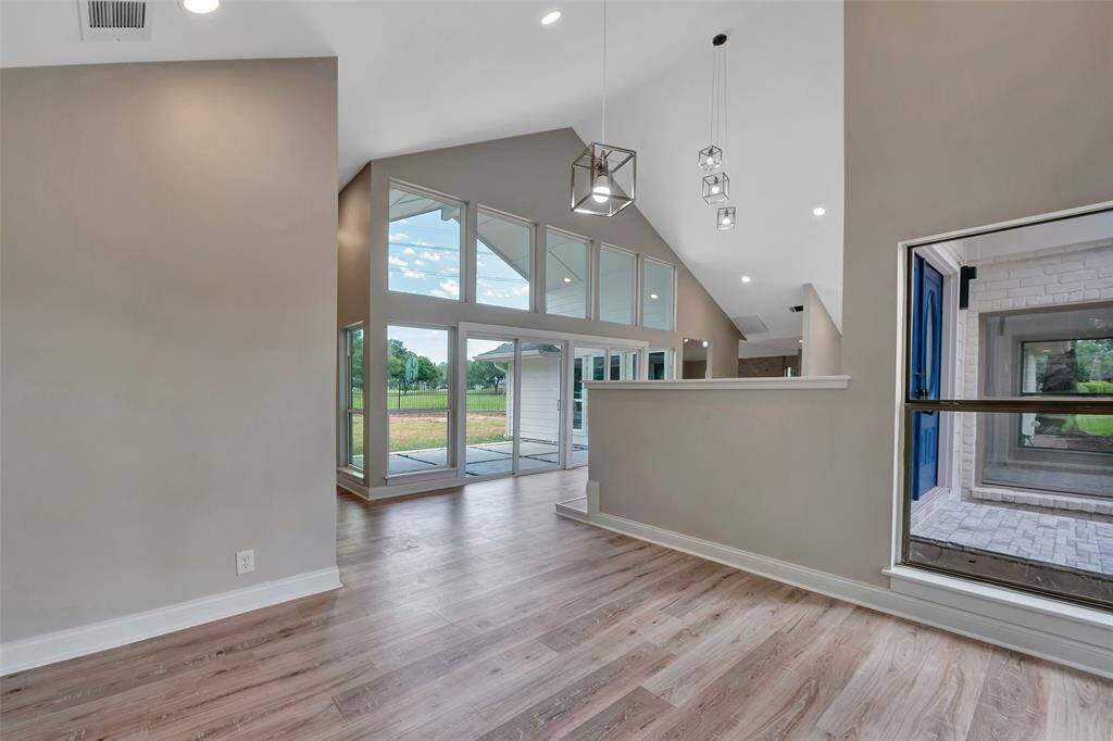 This "sitting room" is opposite the formal dining room with the double door entry in between.