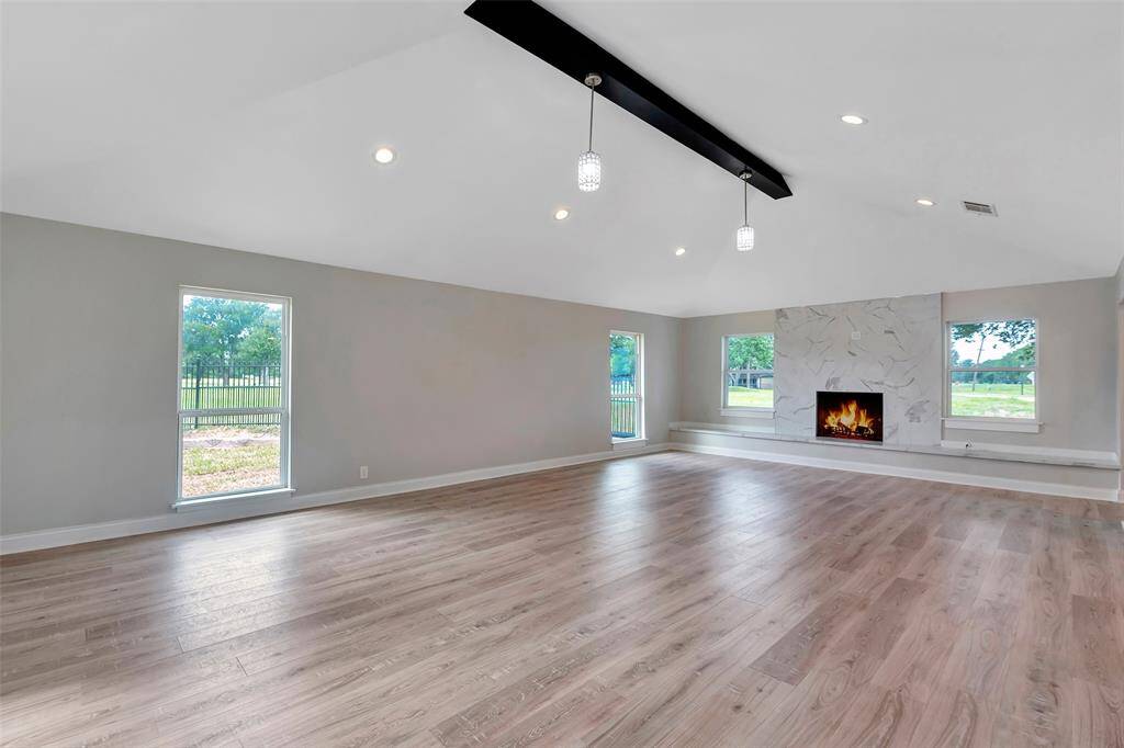 Another view of this living room and the wooded / nature-heavy views it offers!