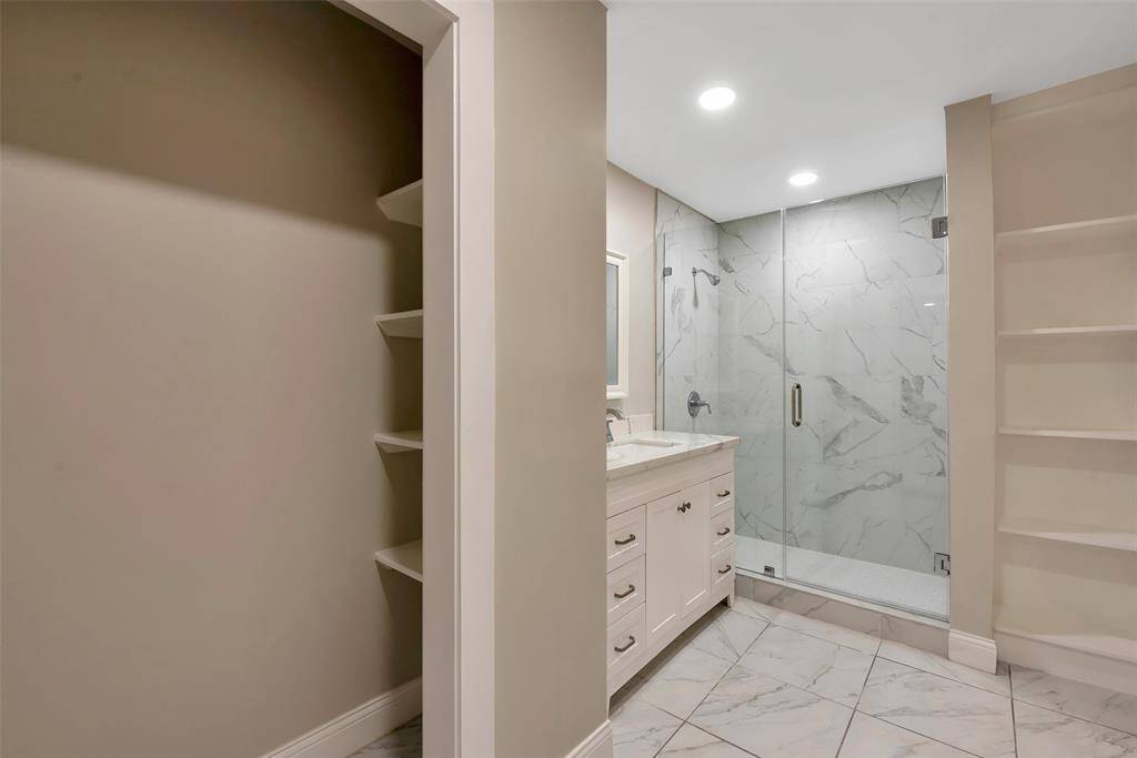 2nd Bathroom has also been completely updated with designer mirror, new toilet, large porcelian tiles, a new vanity and light fixtures. All plumbing hardware and fixtures were replaced as well - 2024.