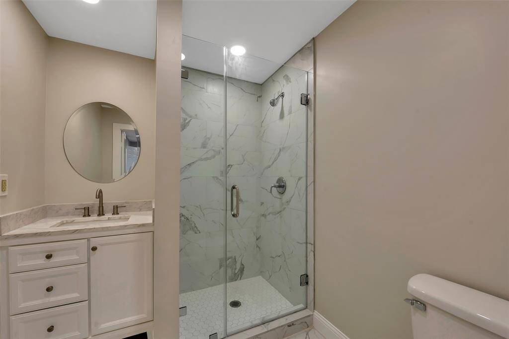 3rd Bathroom - also completely updated with designer mirror, new toilet, large porcelian tiles, a new vanity and light fixtures. All plumbing hardware and fixtures were replaced as well - 2024.