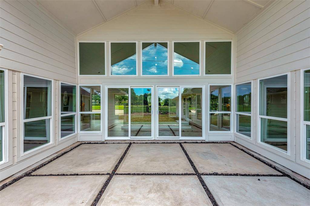 Patio - looking towards the home and all the fantastic windows! The patio and added sod were done 2024.