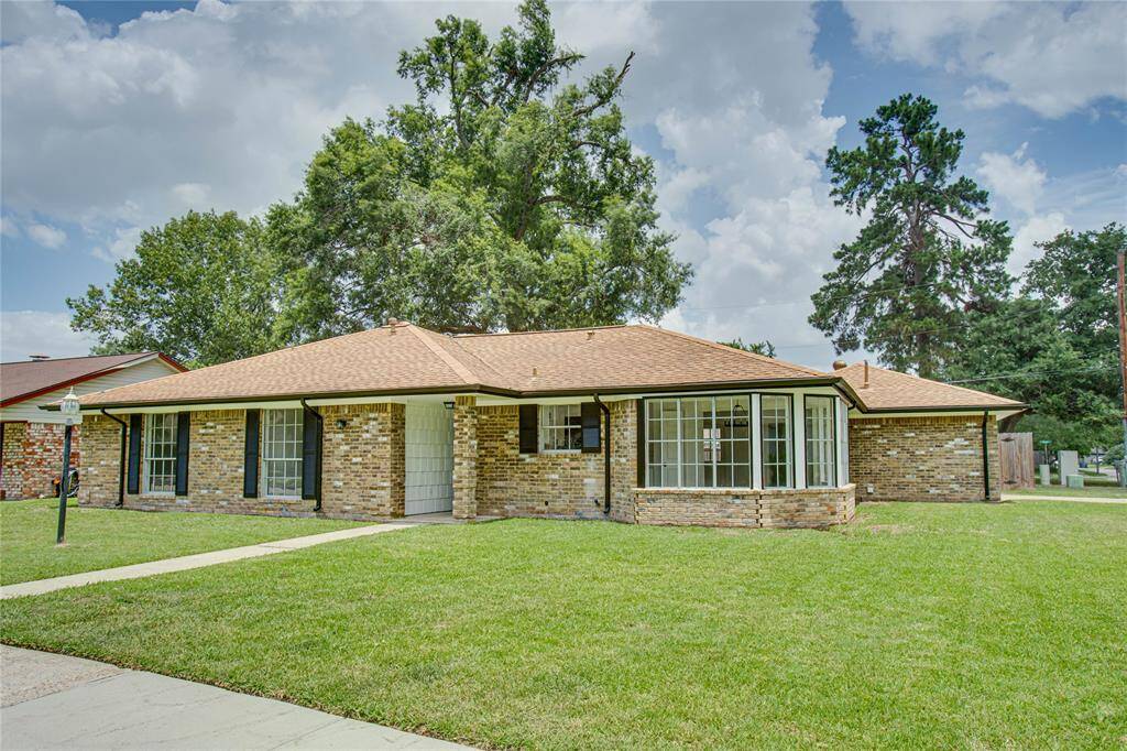 Front of the home that sits on a massive corner lot that also offers new shutters, and a freshly painted exterior!