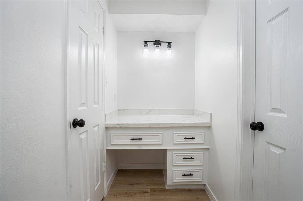 The primary bedroom also offers a vanity area that is perfect for getting ready for those memorable nights!
